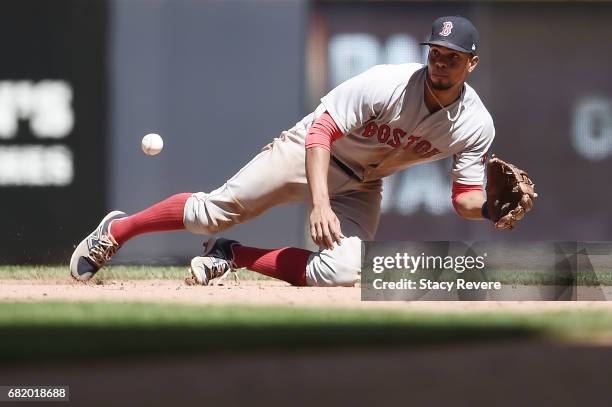 Xander Bogaerts of the Boston Red Sox fields a line drive during the seventh inning of a game against the Milwaukee Brewers at Miller Park on May 11,...