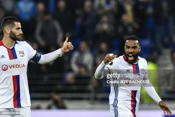 Lyon's French forward Alexandre Lacazette celebrates after scoring a goal during the Europa League semi final football match Olympique Lyonnais vs...