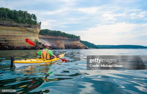 pictured rocks national lakeshore kayaker - lake superior stock pictures, royalty-free photos & images