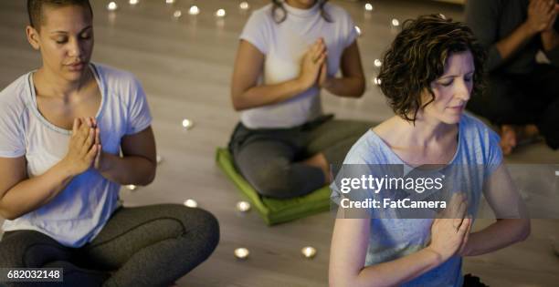 be mindful - candle light stock pictures, royalty-free photos & images