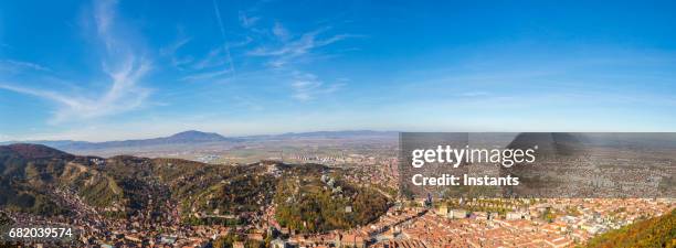 shot from mount tampa, cityscape of the historic romanian city of brasov, situated in transylvania region. - brasov romania stock pictures, royalty-free photos & images