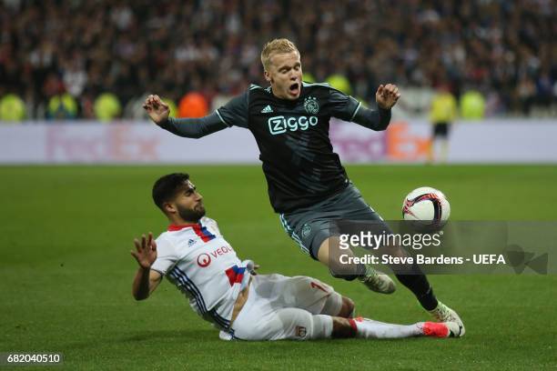 Donny van de Beek of Ajax Amsterdam is tackled by Nabil Fekir of Olympique Lyonnais during the Uefa Europa League, semi final second leg match,...