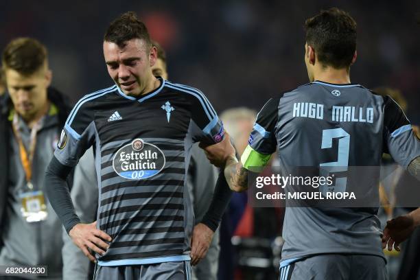 Celta Vigo's Spanish striker Iago Aspas and Celta Vigo's Spanish defender Hugo Mallo react on the pitch to their defeat in the tie after the UEFA...