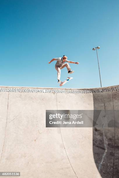 skateboarder in air - half pipe stock pictures, royalty-free photos & images