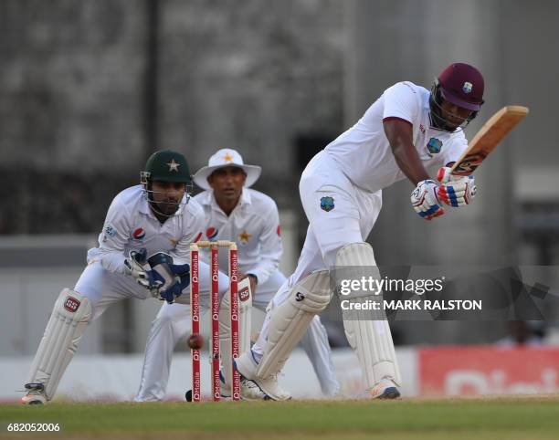 West Indies opener Kieran Powell plays a shot watched by Pakistan wicketkeeper Sarfraz Ahmed on the second day of play in the 3rd and final test...