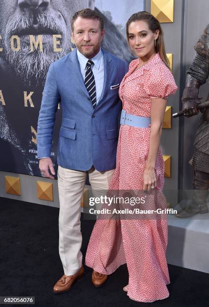 Director Guy Ritchie and model Jacqui Ainsley arrive at the premiere of Warner Bros. Pictures' 'King Arthur: Legend of the Sword' at TCL Chinese...