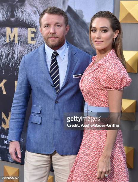 Director Guy Ritchie and model Jacqui Ainsley arrive at the premiere of Warner Bros. Pictures' 'King Arthur: Legend of the Sword' at TCL Chinese...