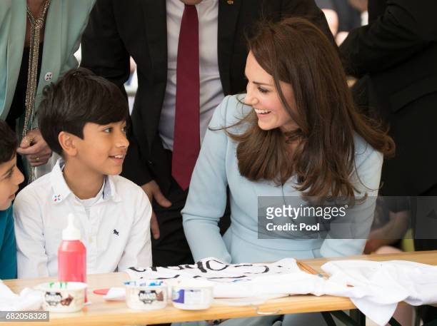 Catherine, Duchess of Cambridge meets children as she visits Place Clairefontaine during a one day visit to Luxembourg on May 11, 2017 in Luxembourg,...