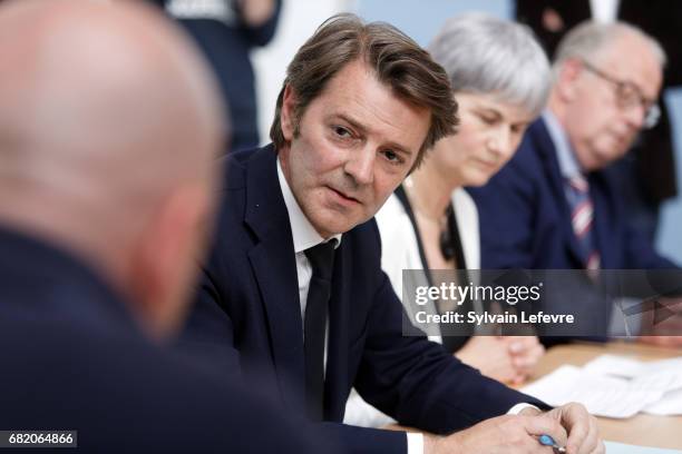 French Right-wing Les Republicains Senator Francois Baroin talks with employees as he visits AlterEos company on May 11, 2017 in Tourcoing, Northern...