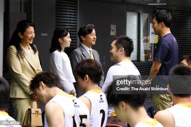 Crown Princess Masako, Princess Aiko and Crown Prince Naruhito talk with players at a wheelchair basketball match at the Tokyo Metropolitan Gymnasium...