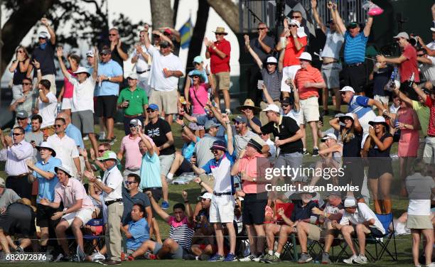 Fans cheer Sergio Garcia's hole-in-one on the 17 island green during the first round of THE PLAYERS Championship on THE PLAYERS Stadium Course at TPC...