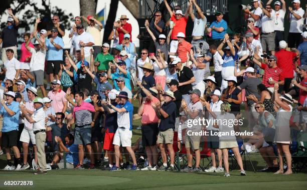 Fans cheer Sergio Garcia's hole-in-one on the 17 island green during the first round of THE PLAYERS Championship on THE PLAYERS Stadium Course at TPC...