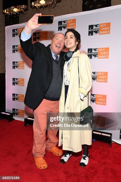 Mario Batali and Nadya Tolokonnikova take a selfie during the WITNESS 25th Anniversary Gala at The Edison Ballroom on May 11, 2017 in New York City.