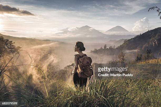 woman admiring the view while trekking
