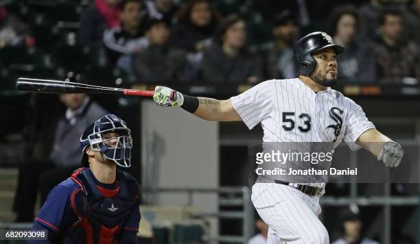 Melky Cabrera of the Chicago White Sox follows the flight of his three-run home run in the 5th inning against the Minnesota Twins at Guaranteed Rate...