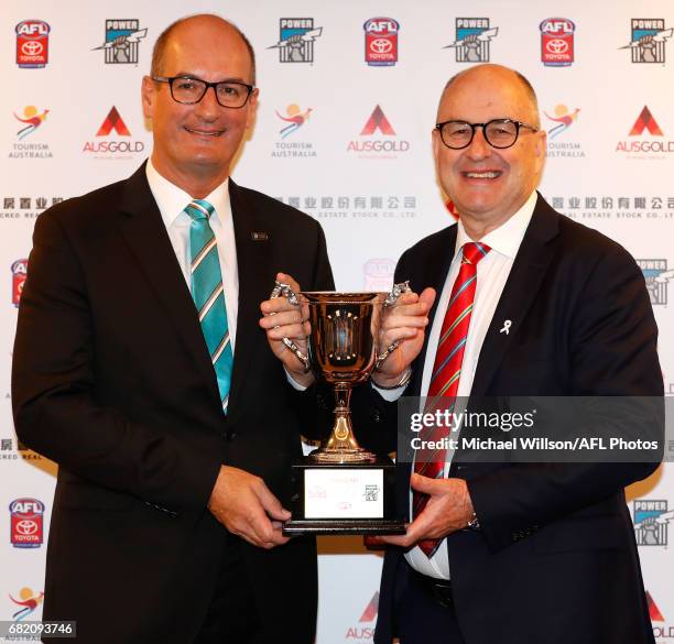 David Koch, Chairman of the Power and Tony Cochrane, Chairman of the Suns pose for a photograph with the 2017 Shanghai Cup during the Port Adelaide...