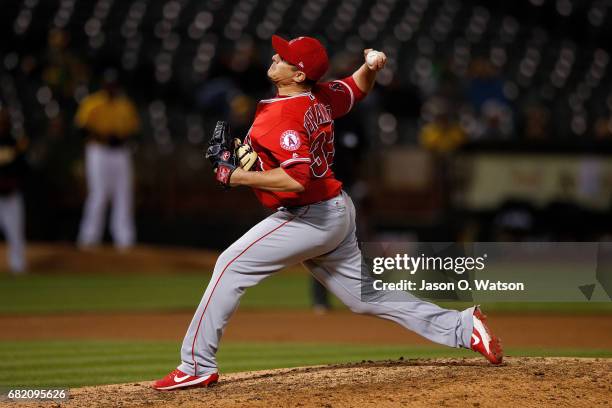 David Hernandez of the Los Angeles Angels of Anaheim pitches against the Oakland Athletics during the eighth inning at the Oakland Coliseum on May 8,...