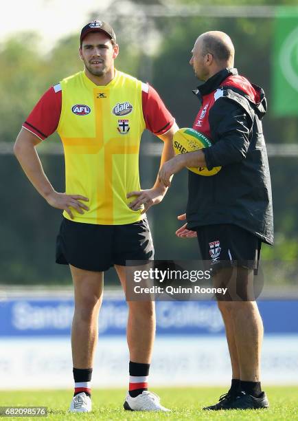 Paddy McCartin of the Saints speaks to Aaron Hamill during a St Kilda Saints AFL training session at Trevor Barker Beach Oval on May 12, 2017 in...