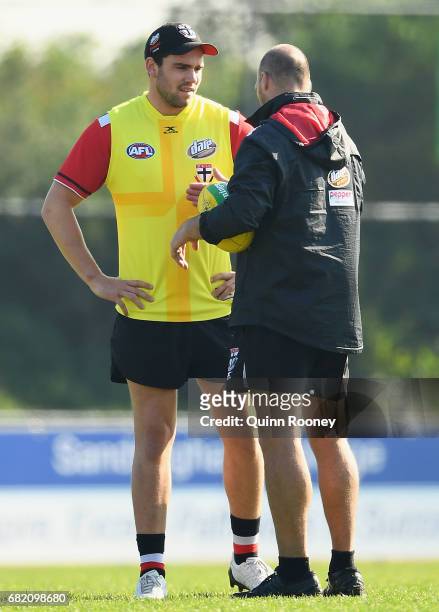 Paddy McCartin of the Saints speaks to Aaron Hamill during a St Kilda Saints AFL training session at Trevor Barker Beach Oval on May 12, 2017 in...