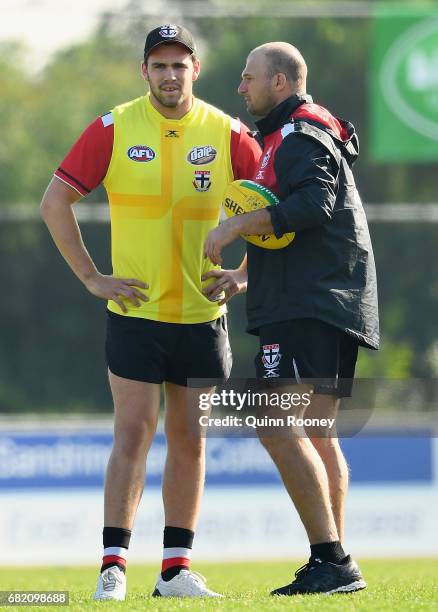 Paddy McCartin of the Saints speaks to Aaron Hamill during a St Kilda Saints AFL training session at Trevor Barker Beach Oval on May 12, 2017 in...