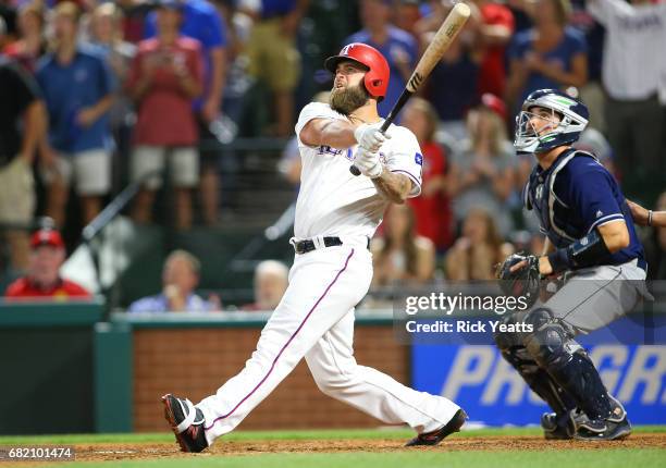 Austin Hedges of the San Diego Padres looks on as Mike Napoli of the Texas Rangers hits a three-run, walk-off home run in the ninth inning at Globe...