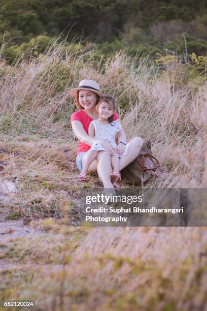 mother & daughter having a great time outdoor - suphat bhandharangsri stock pictures, royalty-free photos & images