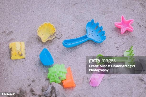 sand toys - a must-equipment for beach - suphat bhandharangsri stock pictures, royalty-free photos & images