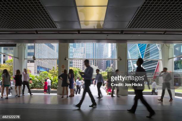 the entrance to raffles place mrt station in singapore's financial district. - singapore stad stockfoto's en -beelden