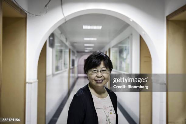 Li Jianyue, professor of life and environment sciences at Shanghai Normal University, poses for a photograph outside a laboratory at Shanghai Normal...