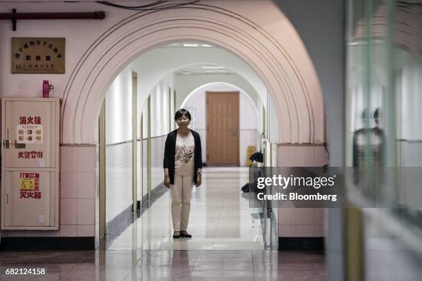 Li Jianyue, professor of life and environment sciences at Shanghai Normal University, poses for a photograph outside a laboratory at Shanghai Normal...