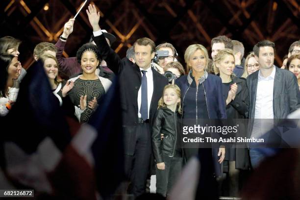 Leader of 'En Marche !' Emmanuel Macron and his wife Brigitte to supporters after winning the French Presidential Election, at The Louvre on May 7,...