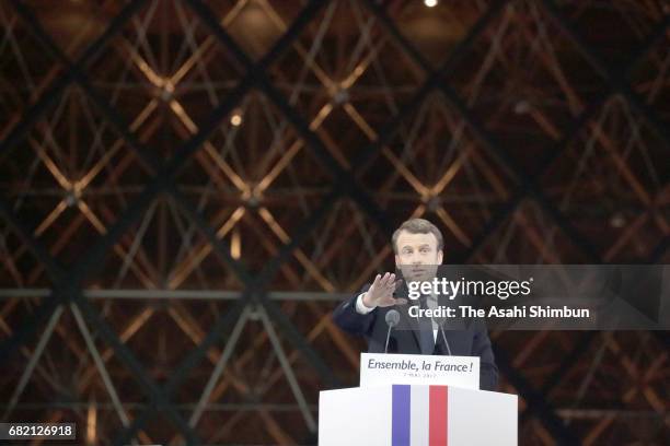 Leader of 'En Marche !' Emmanuel Macron speaks to supporters after winning the French Presidential Election, at The Louvre on May 7, 2017 in Paris,...