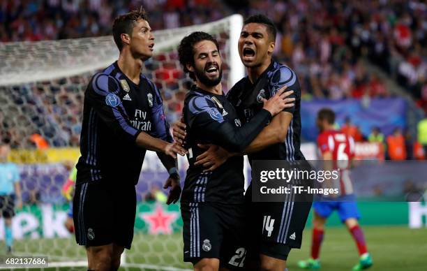 Isco of Real Madrid celebrates after scoring his team`s first goal with Cristiano Ronaldo of Real Madrid and Casemiro of Real Madrid during the UEFA...