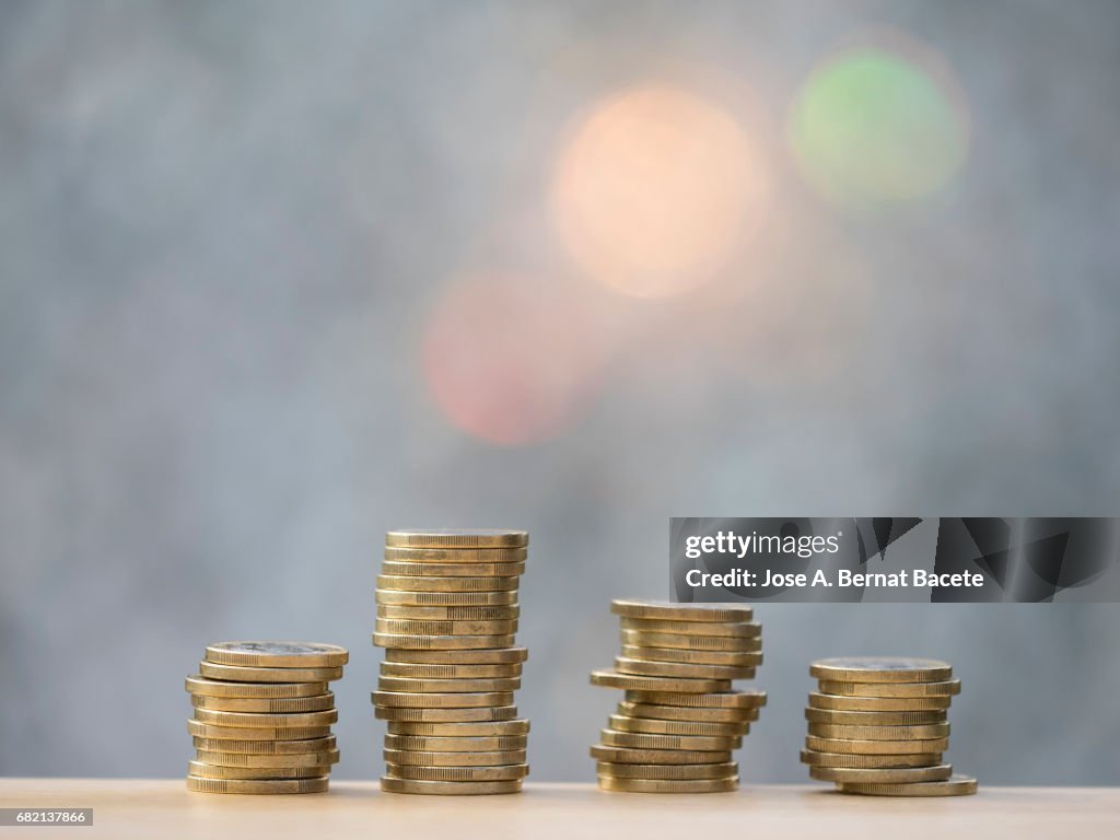 Euro and cent coins arranged In heaps of different sizes