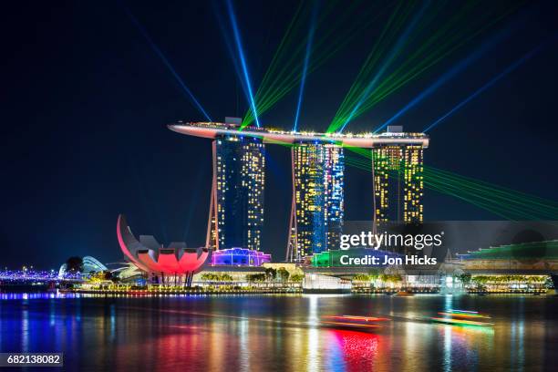 the marina bay sands light show, singapore. - artscience museum stock pictures, royalty-free photos & images