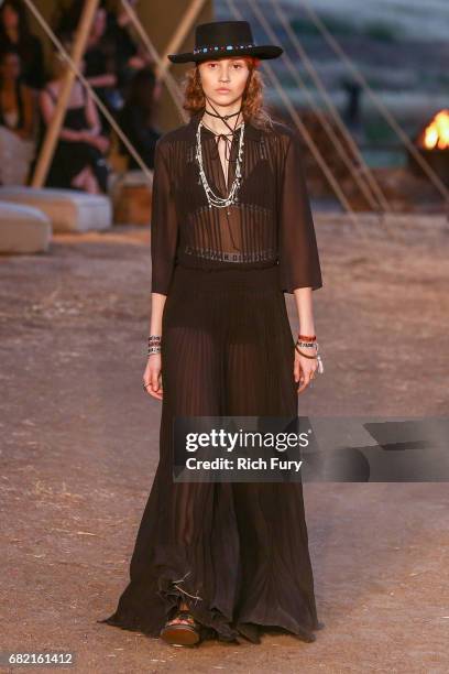 Model walks the runway during the Christian Dior Cruise 2018 Runway Show at the Upper Las Virgenes Canyon Open Space Preserve on May 11, 2017 in...