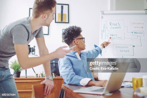 young men working at home office - learning agility stock pictures, royalty-free photos & images