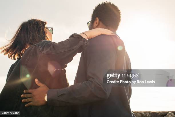 seaside couples - hand on shoulder stock pictures, royalty-free photos & images