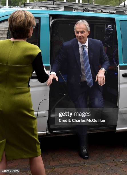 Former British Prime Minister Tony Blair exits a television satellite broadcast van as he attends the European People's Party Group Bureau meeting at...