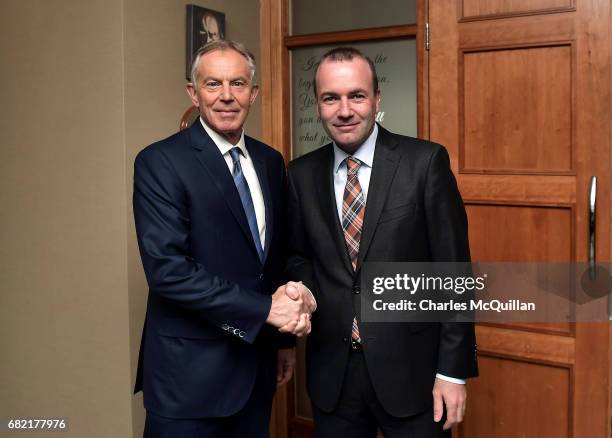 Former British Prime Minister Tony Blair is greeted by EPP Group Chairman Manfred Weber as he arrives for the European People's Party Group Bureau...