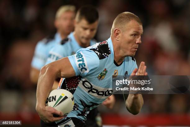 Luke Lewis of the Sharks runs the ball during the round 10 NRL match between the St George Illawarra Dragons and the Cronulla Sharks at UOW Jubilee...