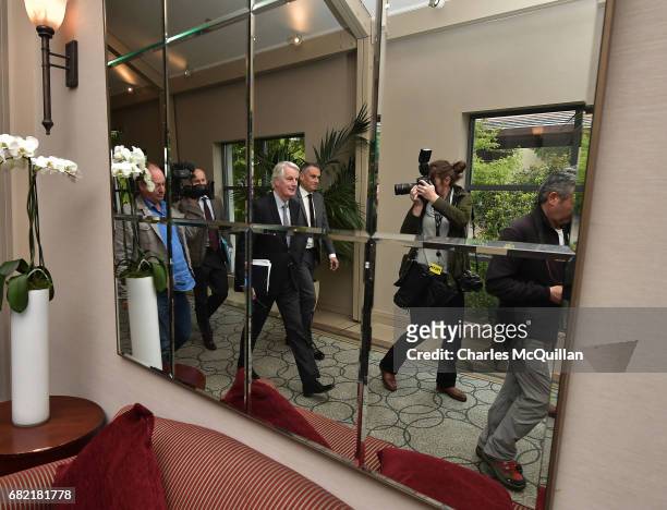 European Commission Brexit chief negotiator Michel Barnier surrounded by media is reflected in a mirror as he arrives for the EPP Group Bureau...