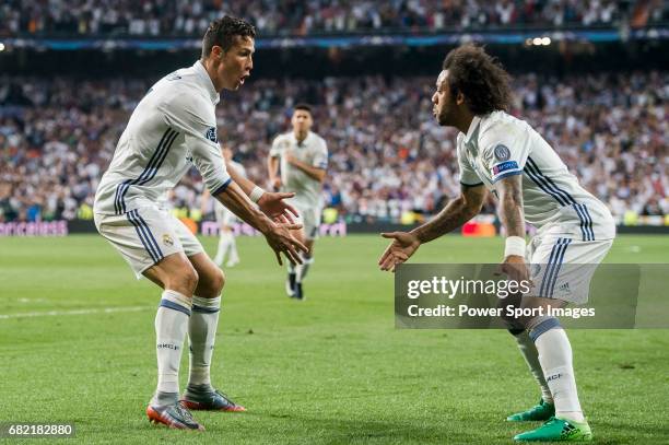 Cristiano Ronaldo of Real Madrid celebrates with teammate Marcelo Vieira Da Silva during their 2016-17 UEFA Champions League Quarter-finals second...