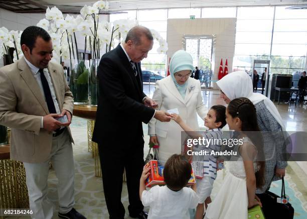 Turkish President Recep Tayyip Erdogan with his wife Emine Erdogan gives Turkish identity cards to seven-year-old Syrian girl Bana Al-Abed, and her...