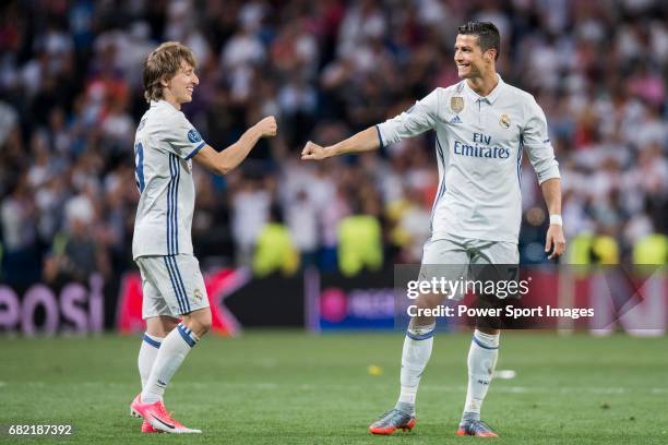 Cristiano Ronaldo and Luka Modric of Real Madrid celebrate winning after their 2016-17 UEFA Champions League Quarter-finals second leg match between...