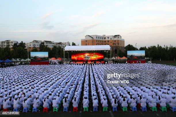 Over 3,000 nurse students of Chengdu Railway Health School dressed in nurse uniforms line up at the playground to celebrate the 106th International...