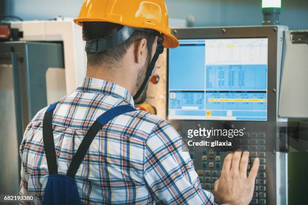 cnc machine operator. - production line worker stock pictures, royalty-free photos & images