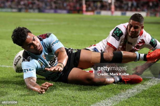 Sosaia Feki of the Sharks scores a try during the round 10 NRL match between the St George Illawarra Dragons and the Cronulla Sharks at UOW Jubilee...
