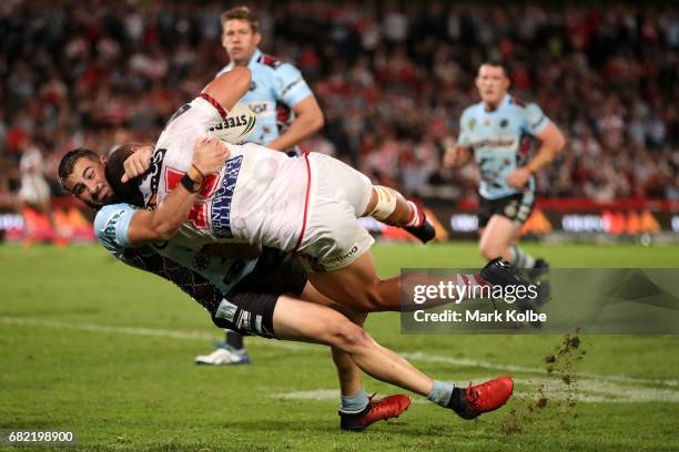 Jack Bird of the Sharks flips Tyson Frizell of the Dragons during the round 10 NRL match between the St George Illawarra Dragons and the Cronulla...