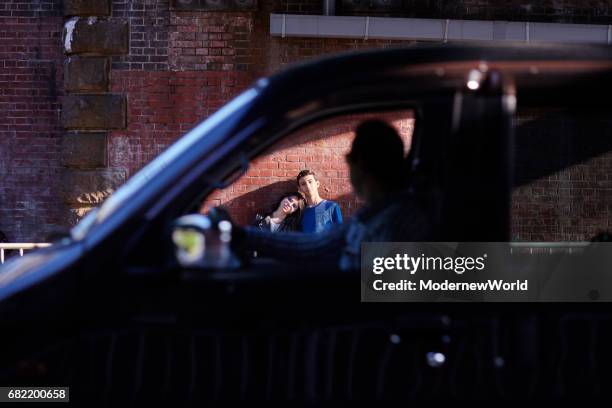 a boy and a girl looking through the passing car window - two cars side by side stock pictures, royalty-free photos & images